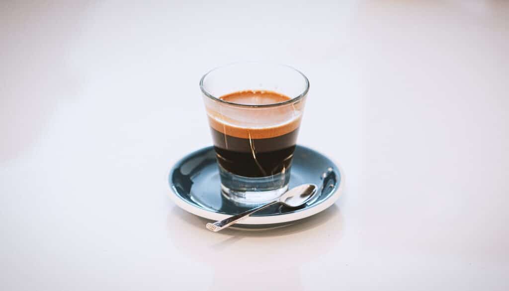 Espresso clear glass cup on saucer